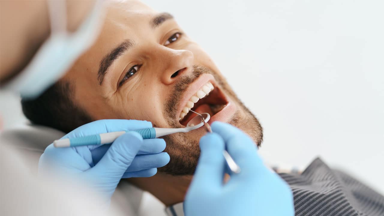 Man at dentist in dental chair